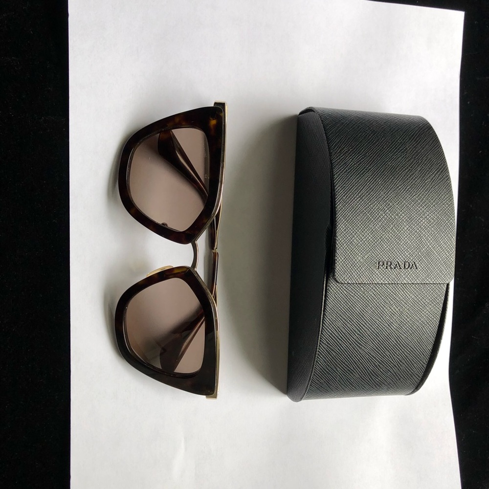 Authentic Prada sunglasses;tortoiseshell trimmed in gold;perfect condition.